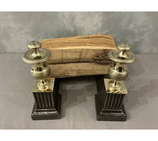 Pair of antique cast iron and brass andirons from the 19th century