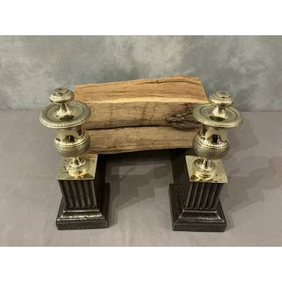 Pair of antique cast iron and brass andirons from the 19th century