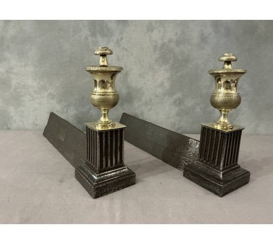 Pair of antique cast iron and brass andirons from the 19th century