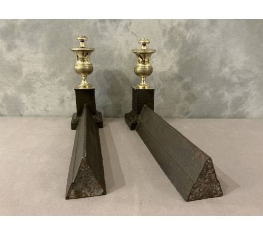 Pair of antique cast iron and brass andirons from the 19th century
