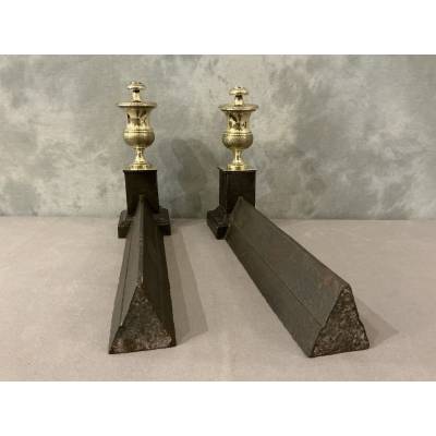 Pair of antique cast iron and brass andirons from the 19th century