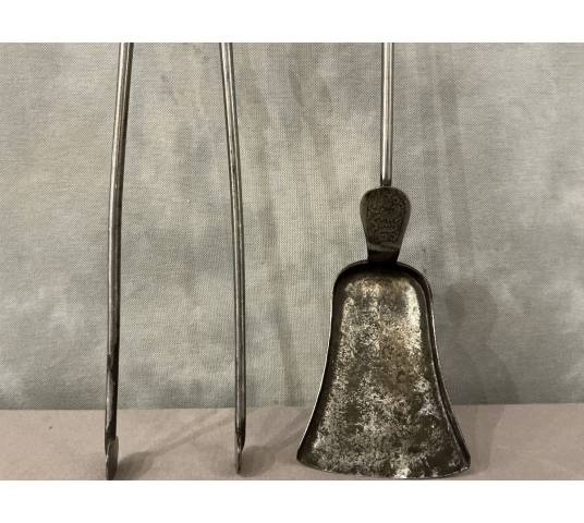 A beautiful set of a 19th-century iron fireplace shovel and tongs.