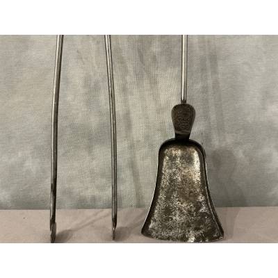 A beautiful set of a 19th-century iron fireplace shovel and tongs.