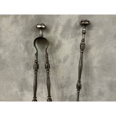 A beautiful set of a 19th-century iron fireplace shovel and tongs.