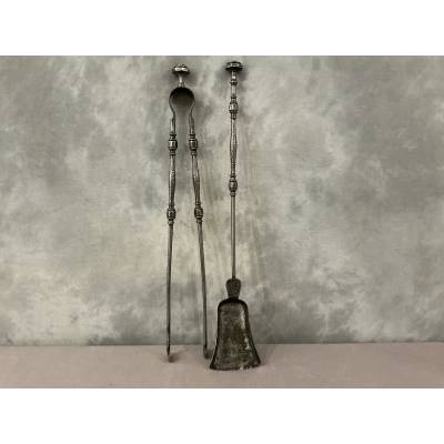 A beautiful set of a 19th-century iron fireplace shovel and tongs.