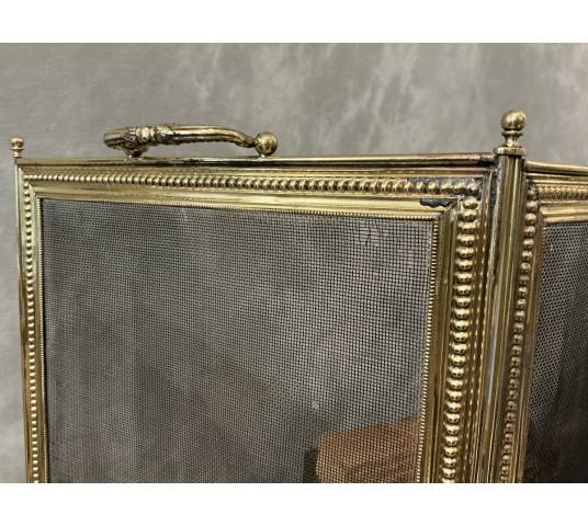 Pare feu de cheminée ancien en laiton de style Louis XVI