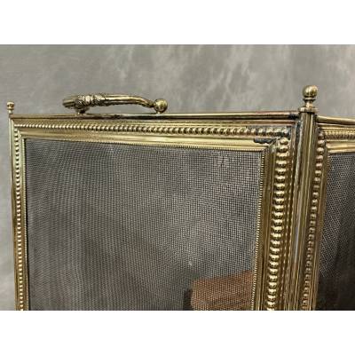 Pare feu de cheminée ancien en laiton de style Louis XVI