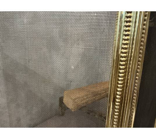 Pare feu de cheminée ancien en laiton de style Louis XVI