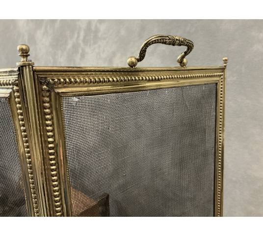 Pare feu de cheminée ancien en laiton de style Louis XVI