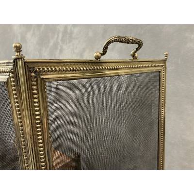 Pare feu de cheminée ancien en laiton de style Louis XVI