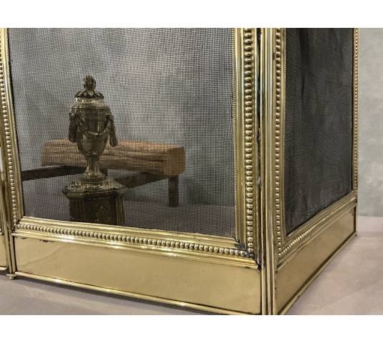 Pare feu de cheminée ancien en laiton de style Louis XVI