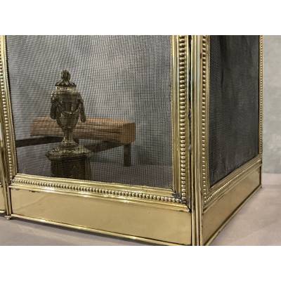 Pare feu de cheminée ancien en laiton de style Louis XVI