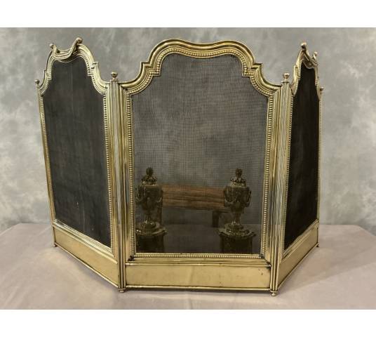 Small antique brass fire screen dating from the 19th century in the Louis XVI style
