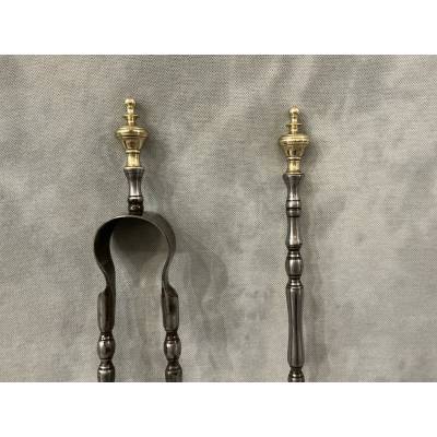 A set of a 19th-century iron fireplace shovel and tongs.