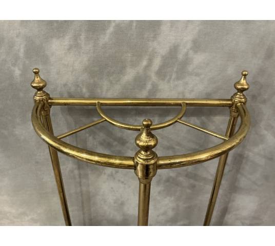Semi-circular umbrella stand in brass and cast iron, circa 1900