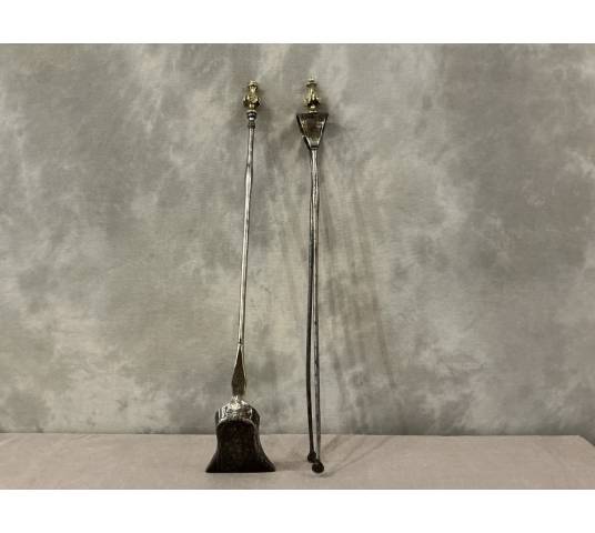 A 19th-century iron and bronze shovel and tongs set