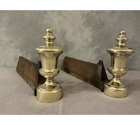 Pair of antique cast iron and brass andirons from the 19th century