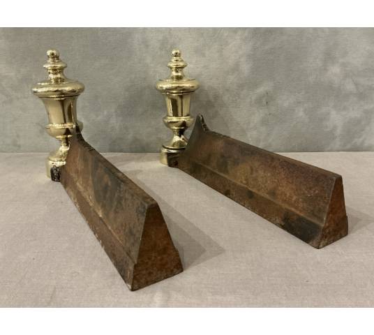 Pair of antique cast iron and brass andirons from the 19th century