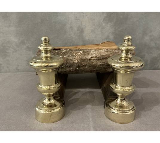 Pair of antique cast iron and brass andirons from the 19th century