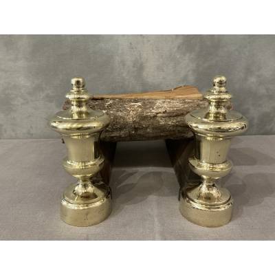 Pair of antique cast iron and brass andirons from the 19th century