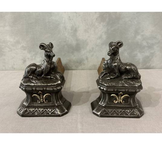 Pair of antique cast iron andirons depicting goats from the 19th century