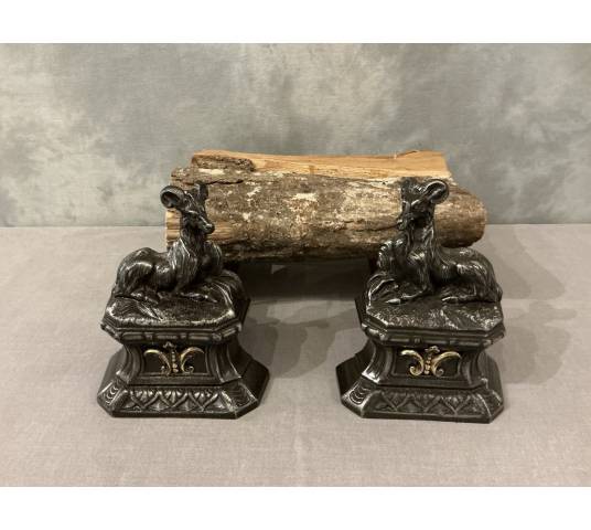 Pair of antique cast iron andirons depicting goats from the 19th century