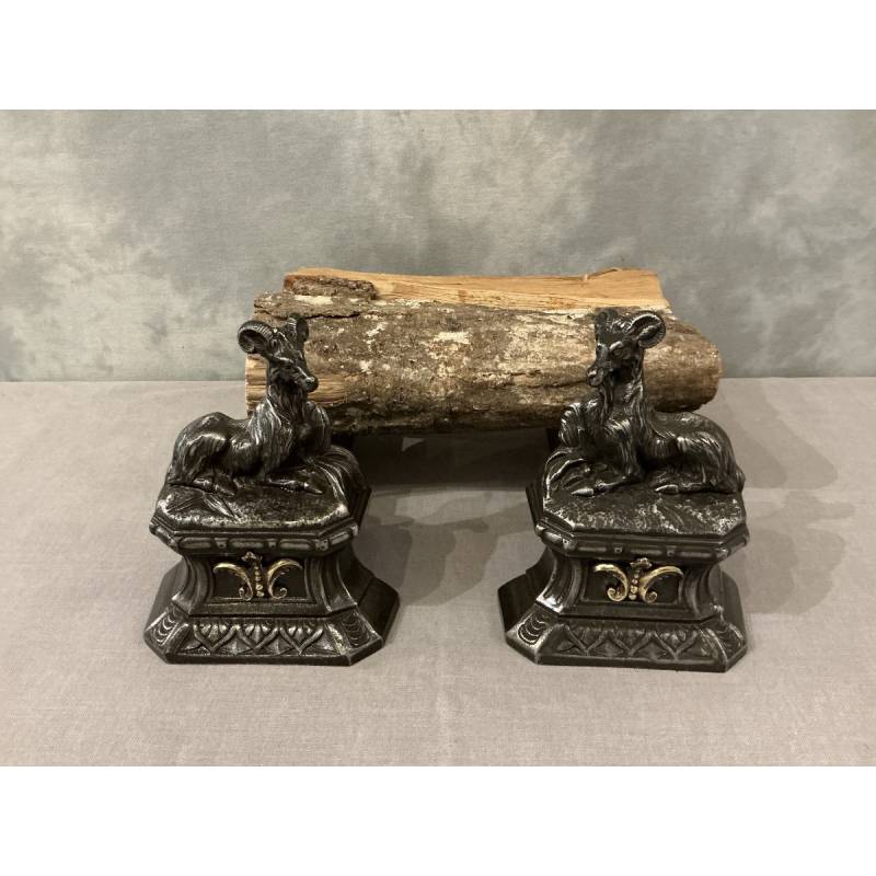 Pair of antique cast iron andirons depicting goats from the 19th century