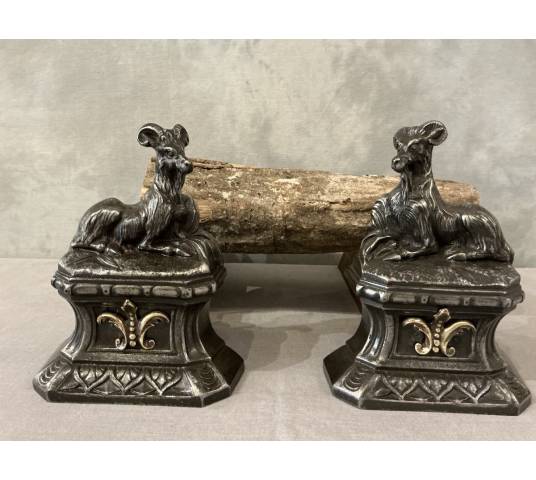 Pair of antique cast iron andirons depicting goats from the 19th century