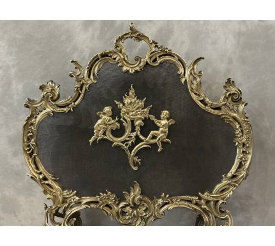 Ecran de cheminée en bronze poli et vernis d'époque 19 ème