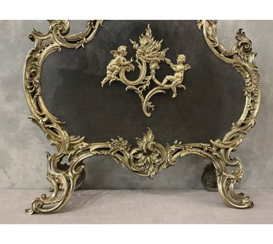 Ecran de cheminée en bronze poli et vernis d'époque 19 ème