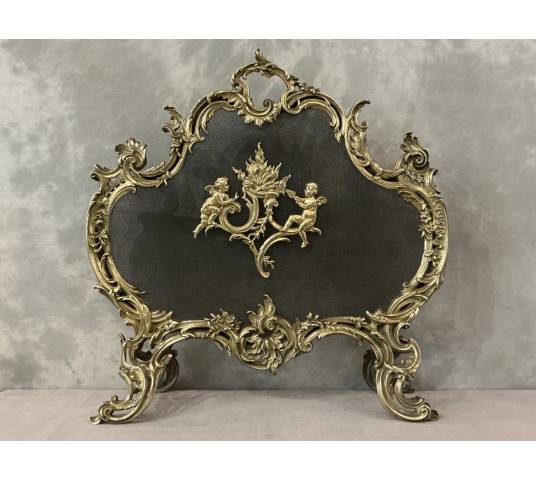 Ecran de cheminée en bronze poli et vernis d'époque 19 ème