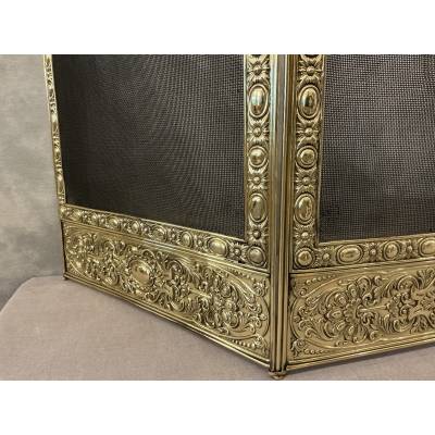 Antique pressed brass fireplace screen from the 19th century