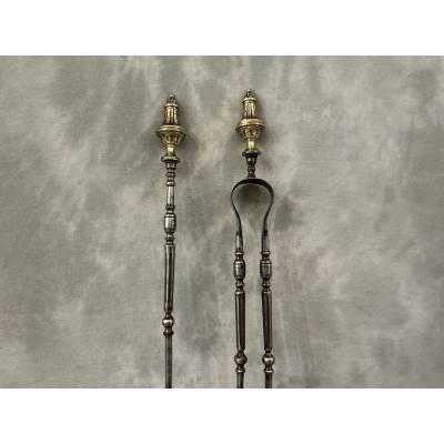 Large set of a shovel and tongs in iron and bronze from the 19th century