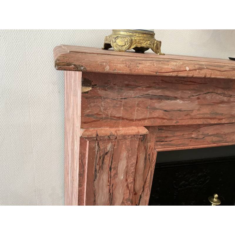 Decorative painted wooden fireplace from the late 19th century