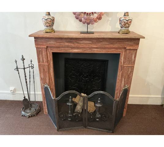 Decorative painted wooden fireplace from the late 19th century