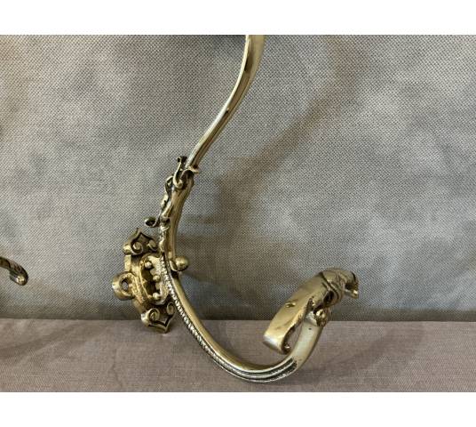 Two coat racks, polished and varnished bronze hooks from the 19th century