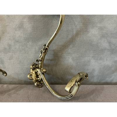 Two coat racks, polished and varnished bronze hooks from the 19th century