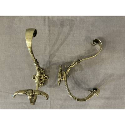Two coat racks, polished and varnished bronze hooks from the 19th century