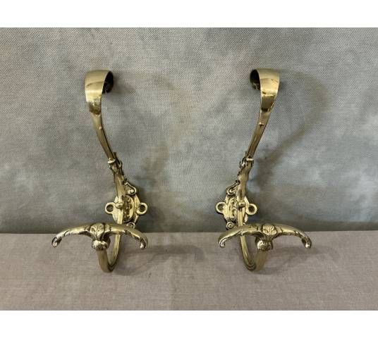 Two coat racks, polished and varnished bronze hooks from the 19th century
