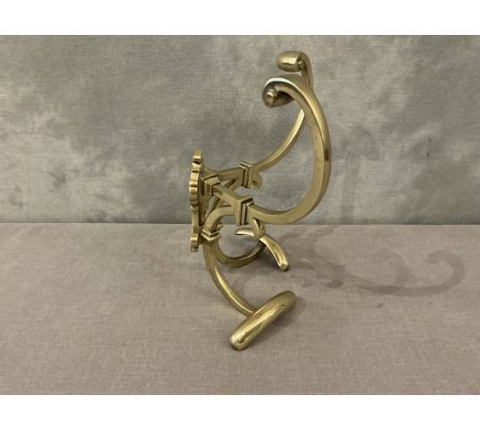 Antique double coat rack in polished and varnished brass, 19th century