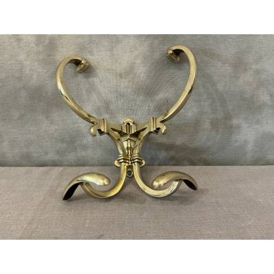 Antique double coat rack in polished and varnished brass, 19th century