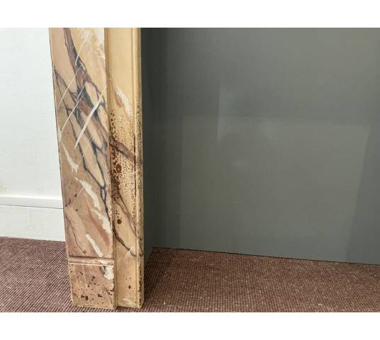 Decorative painted wooden fireplace from the late 19th century
