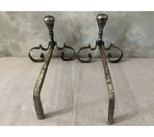 Pair of antique wrought iron andirons from the 18th century