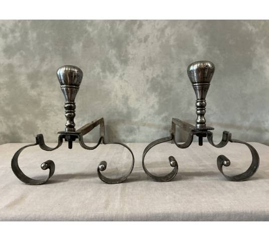 Pair of antique wrought iron andirons from the 18th century