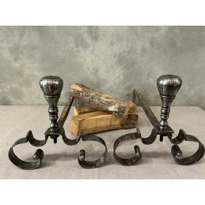 Pair of antique wrought iron andirons from the 18th century