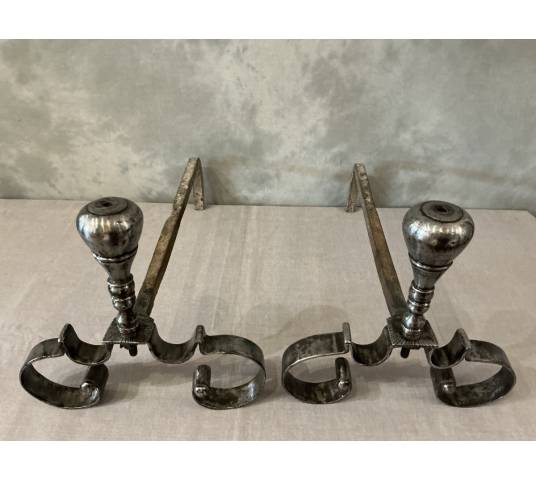 Pair of antique wrought iron andirons from the 18th century
