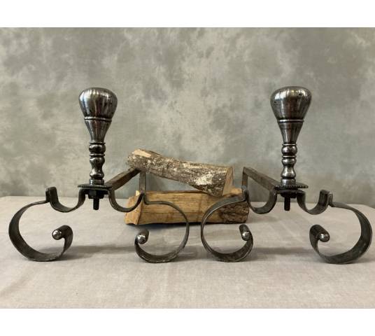 Pair of antique wrought iron andirons from the 18th century