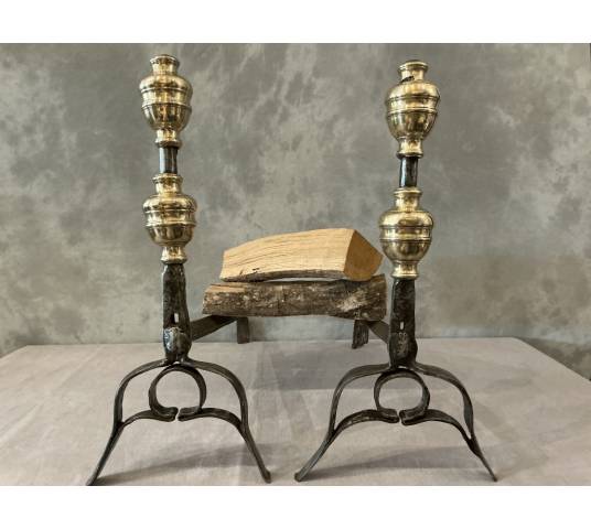 Pair of antique wrought iron and brass andirons dating from the 17th century