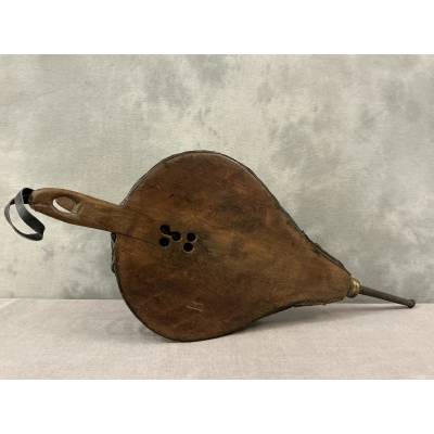 Antique rustic wooden fireplace bellows from the 18th century