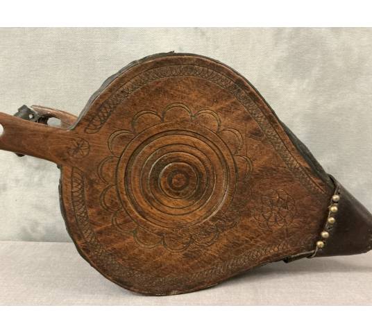 Antique rustic wooden fireplace bellows from the 18th century